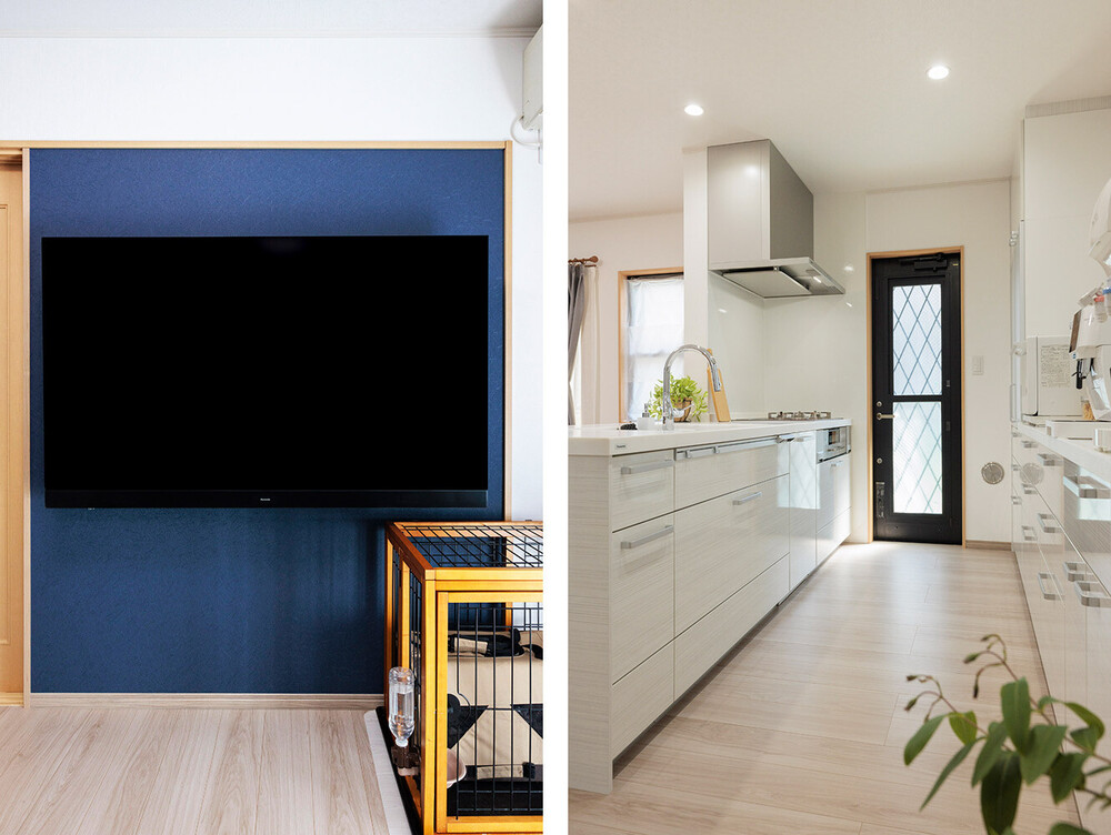 紺色のアクセントクロスが効いた壁掛けテレビコーナーと開放感あふれる（食洗機や収納も充実した）対面キッチン