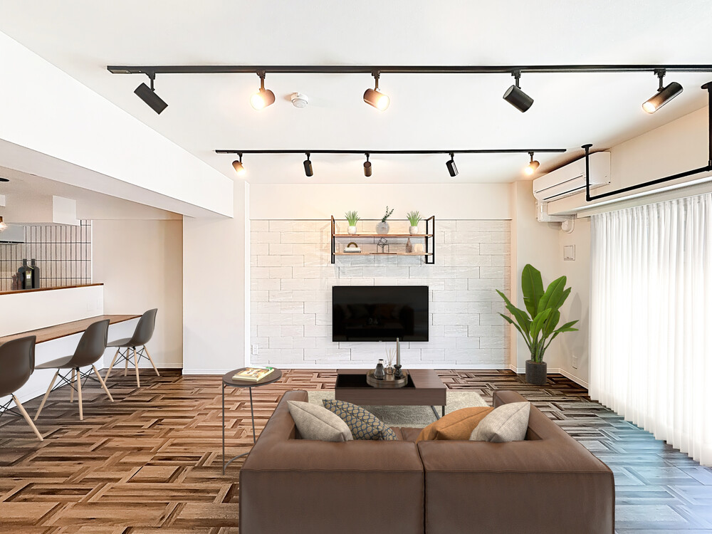 リビング正面の壁にはホワイトのエコカラットを施工。普段の食事やデスクワークはキッチンカウンターでされているそうです。